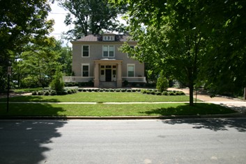 U-Shaped Driveway with Concrete Curb and Gravel Surface